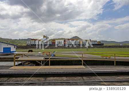 Container ship passing Panama Canal railway view Container ship passing Panama Canal railway view 138910120