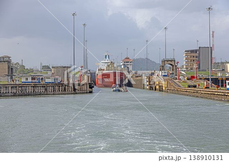 Panama Canal lock with cargo ship passing through gates 138910131