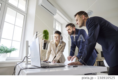 Business team meeting at computer in modern office, strategy planning and analysis 138910525