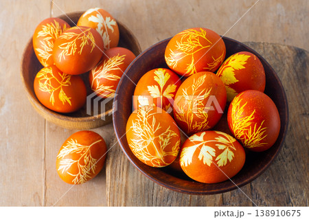 Easter eggs dyed with onion peel, dill and parsley. Natural eco dyes. Egg on the table top view food background. 138910675