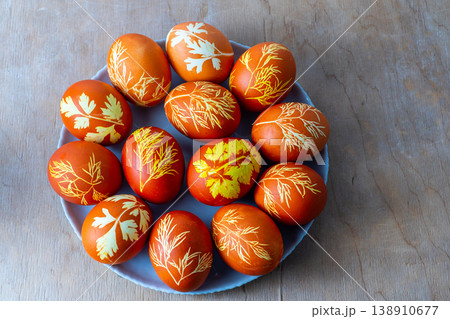 Easter eggs dyed with onion peel, dill and parsley. Natural eco dyes. Egg on the table top view food background. Easter eggs dyed with onion peel, dill and parsley. Natural eco dyes. Egg on the table top view food background. 138910677