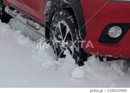 Red truck in the deep snow at the off road outdoor adventure Red truck in the deep snow at the off road outdoor adventure 138910990