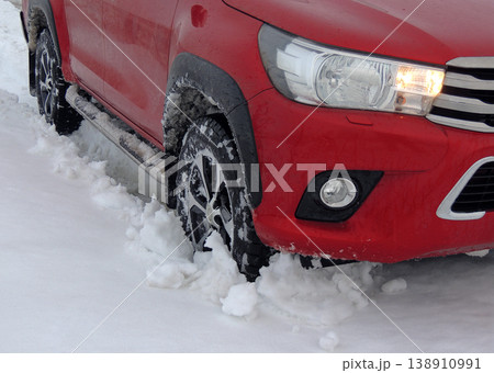 Front wheel of the truck in deep snow on the country road Front wheel of the truck in deep snow on the country road 138910991