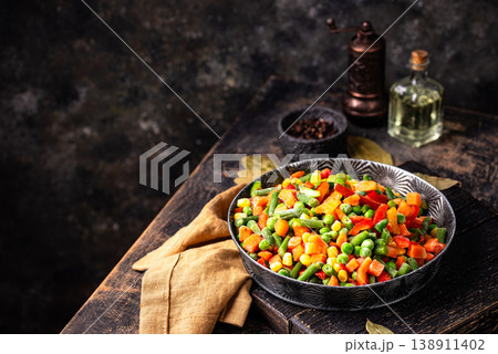 Frozen mix of vegetables on dark background 138911402