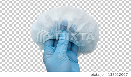 Hand holding disposable blue medical bouffant hair cap, isolated on transparent background, representing hygiene, food service, and healthcare settings Hand holding disposable blue medical bouffant hair cap, isolated on transparent background, representing hygiene, food service, and healthcare settings 138912067