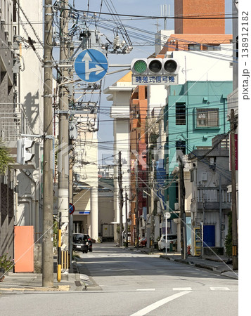 Urban street scene with traffic lights and overhead wires in Japan 138912182