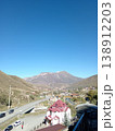 Hidikus mountain village, Kurtatinsky Gorge, North Ossetia, Russia, bright summer day. Small community of stone houses surrounded by Caucasus peaks 138912203