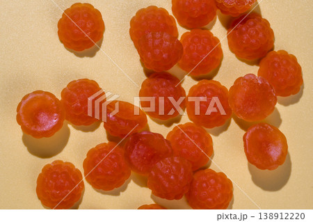 Jelly gummies close-up, fruit vitamins raspberry shaped, food supplements.Orange vitamins candies Jelly gummies close-up, fruit vitamins raspberry shaped, food supplements.Orange vitamins candies 138912220