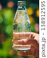 Refreshing moment captured in a sunny garden with sparkling water 138912595