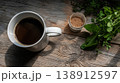 Cozy afternoon coffee moment with fresh herbs and spices on a wooden table 138912597