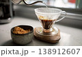 Pour-over coffee magic unfolds in a cozy kitchen setting with rich aromas 138912607