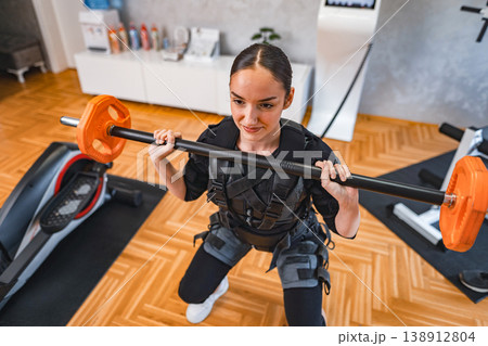Woman tries new resistance training workout Woman tries new resistance training workout 138912804