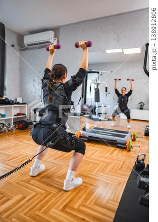 Full-body indoor workout with new training gear Full-body indoor workout with new training gear 138912806