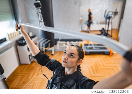 Empowering workout session in a modern fitness studio Empowering workout session in a modern fitness studio 138912808