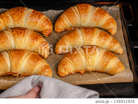 Fresh baked croissants on tray just out of oven Fresh baked croissants on tray just out of oven 138912928