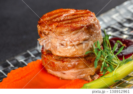 Grilled pork medallions with vegetable puree and microgreens gourmet dish 138912961
