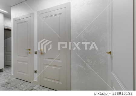 Bright Corridor Perspective with Multiple Classic White Doors Bright Corridor Perspective with Multiple Classic White Doors 138913158