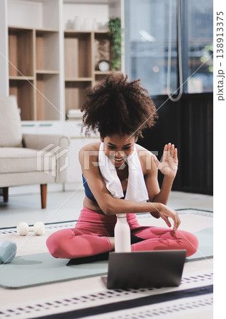 Women exercising in fitness studio yoga classes Women exercising in fitness studio yoga classes 138913375