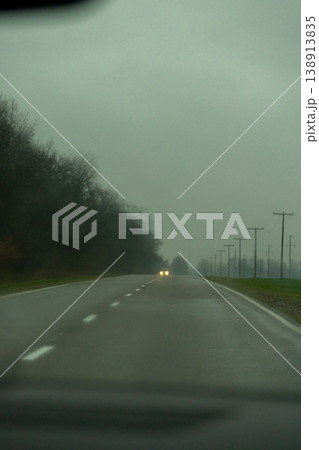 driver's view of the road from car window, the view through the windshield. 138913835