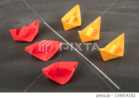 Market Competition Conflict Concept With Red and Yellow Paper Boats Divided by Line Market Competition Conflict Concept With Red and Yellow Paper Boats Divided by Line 138914282
