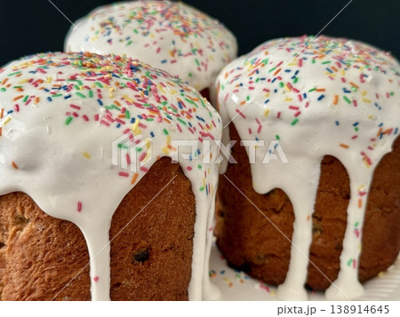Easter cakes with white icing and sprinkles. A traditional homemade Easter pastry. 138914645