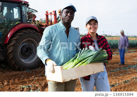 Two farmers posing on leaf vegetables field Two farmers posing on leaf vegetables field 138915894