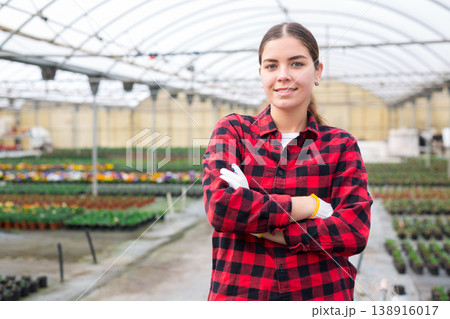 Female florist posing at greenhouse 138916017