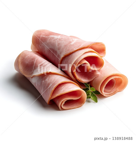 Rolls of Freshly Sliced Ham with Green Herb Garnish on White Background Rolls of Freshly Sliced Ham with Green Herb Garnish on White Background 138918488