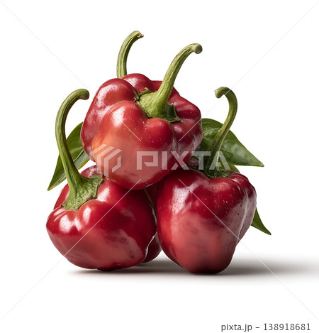 Fresh and Vibrant Red Bell Peppers with Glossy Skin and Green Leaves for Culinary Use 138918681