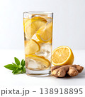 Refreshing Lemon Ginger Drink with Ice Cubes and Fresh Ingredients in Glass Refreshing Lemon Ginger Drink with Ice Cubes and Fresh Ingredients in Glass 138918895