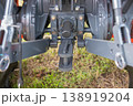 Rear end of farm tractor showing the PTO shaft and three point hitch  is used to connect agricultural implements. 138919204