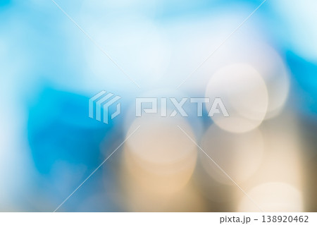 Soft blue and gold bokeh abstract background with blurred light circles and copy space Soft blue and gold bokeh abstract background with blurred light circles and copy space 138920462