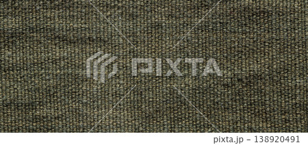 Dark olive green coarse woven burlap fabric texture background close-up 138920491