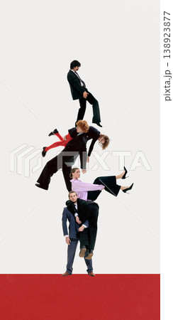 Group of business people balancing each other in human tower teamwork. Group of business people balancing each other in human tower teamwork. 138923877