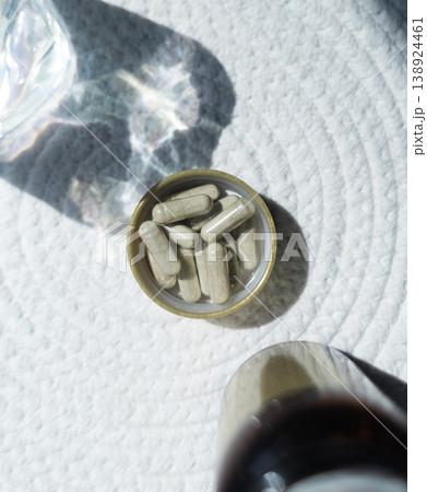 Close-up of iron supplement capsules in a lid for iron deficiency anemia treatment. Health care, wellness, and dietary supplements for daily vitamins and minerals intake. Close-up of iron supplement capsules in a lid for iron deficiency anemia treatment. Health care, wellness, and dietary supplements for daily vitamins and minerals intake. 138924461