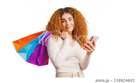 Woman shopping online with smartphone and bags Woman shopping online with smartphone and bags 138924683