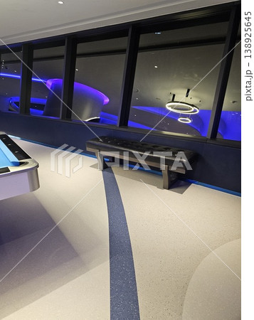 Pool table is surrounded by a blue and white floor 138925645