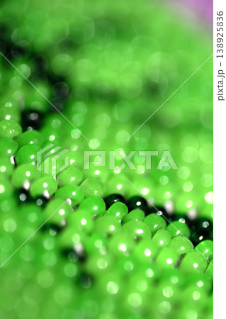 Cute craft small glass beads in an abstract pattern for background Cute craft small glass beads in an abstract pattern for background 138925836