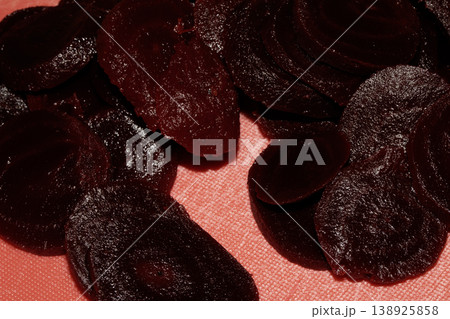 Close up of chopped red beetroot on a red background Close up of chopped red beetroot on a red background 138925858