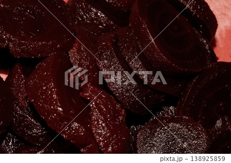 Close up of chopped red beetroot on a red background 138925859