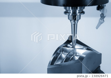 High-precision CNC milling machine finishing an injection mold part using a ball nose end mill tool. High-precision CNC milling machine finishing an injection mold part using a ball nose end mill tool. 138926471