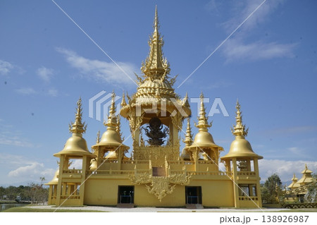 Large golden building with a bell tower and a statue of Ganesha Large golden building with a bell tower and a statue of Ganesha 138926987