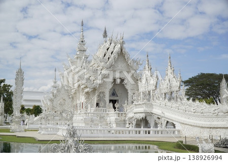 White building with a lot of white details and a white roof White building with a lot of white details and a white roof 138926994