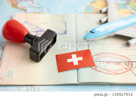Switzerland flag with passport and airplane for travel. 138927918