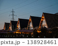 Charming A-Frame Cabins with Warm Lighting at Dusk 138928461