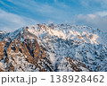 Snow-Capped Mountain Range Under Blue Sky 138928462