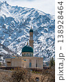 Mosque Surrounded by Snowy Mountains 138928464