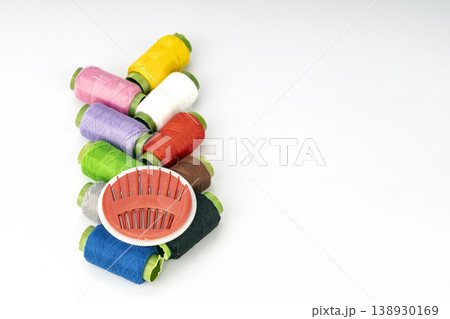 Vibrant Embroidery Thread Spools Collection with Red Needle Pincushion, Organizing Sewing and Crafting Supplies for Needlework Projects Vibrant Embroidery Thread Spools Collection with Red Needle Pincushion, Organizing Sewing and Crafting Supplies for Needlework Projects 138930169