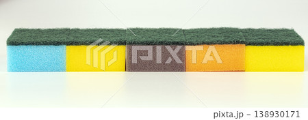 Set of Colorful Kitchen Sponges Arranged in a Row - Blue, Yellow, Brown, Orange Cleaning Supplies Set of Colorful Kitchen Sponges Arranged in a Row - Blue, Yellow, Brown, Orange Cleaning Supplies 138930171