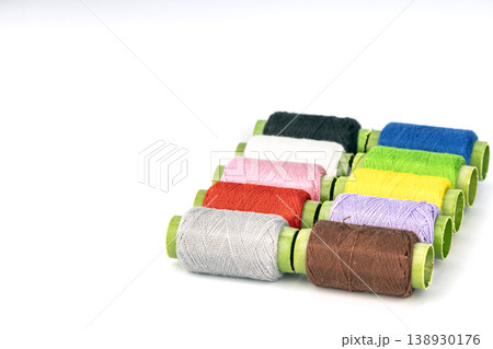 Organized Colorful Thread Spools with Green Cardboard Tubes - Complete Craft Supply Collection for Sewing, Embroidery, and DIY Projects Organized Colorful Thread Spools with Green Cardboard Tubes - Complete Craft Supply Collection for Sewing, Embroidery, and DIY Projects 138930176